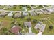 Aerial view of homes in a planned community with pools and landscaping at 26090 Huanuco Dr, Punta Gorda, FL 33983