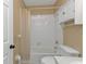 Bathroom features a shower/tub combo, toilet, sink, and white tiles at 26090 Huanuco Dr, Punta Gorda, FL 33983