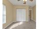 Spacious bedroom with large closet and neutral carpet at 26090 Huanuco Dr, Punta Gorda, FL 33983