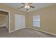 View of bedroom interior showing closet, window, carpet, and doorway at 26090 Huanuco Dr, Punta Gorda, FL 33983