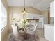 Dining area with glass-top table and access to the kitchen at 26090 Huanuco Dr, Punta Gorda, FL 33983
