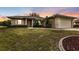 Front exterior of a house at sunset at 26090 Huanuco Dr, Punta Gorda, FL 33983