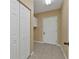 Laundry room with white cabinets and tile flooring at 26090 Huanuco Dr, Punta Gorda, FL 33983