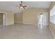 Large living area with tile floors and sliding glass door at 26090 Huanuco Dr, Punta Gorda, FL 33983