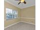 Empty room suitable for use as an office or den, with large window at 26090 Huanuco Dr, Punta Gorda, FL 33983