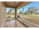 Screened porch with tile flooring and views of the backyard at 26090 Huanuco Dr, Punta Gorda, FL 33983