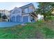 Two-story home with a three-car garage and lush green landscaping at 276 Lewis Cir # 112, Punta Gorda, FL 33950