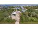 Aerial view of waterfront lot with detached garage and gate at 2877 Howe Rd, Port Charlotte, FL 33981