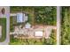 Aerial view showing a house, detached garage, and additional land at 2877 Howe Rd, Port Charlotte, FL 33981