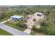 Aerial view of property with house, detached garage, and large lot at 2877 Howe Rd, Port Charlotte, FL 33981