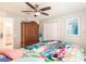 Bedroom with ceiling fan, large closet, and ensuite bath at 2877 Howe Rd, Port Charlotte, FL 33981