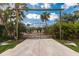 Ornate metal gate entrance with deer design accents leads to a private property at 2877 Howe Rd, Port Charlotte, FL 33981