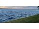 Sunset view of a lake with some visible homes on the opposite shore at 2877 Howe Rd, Port Charlotte, FL 33981