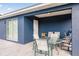 Covered patio with table and chairs, perfect for outdoor dining at 2877 Howe Rd, Port Charlotte, FL 33981
