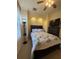 Well-lit bedroom featuring a ceiling fan, built-in alcove, and wooden furniture at 3100 Sheboygan Ave, North Port, FL 34286