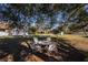 Shady backyard oasis with seating area under a tree at 3262 Steadman St, Punta Gorda, FL 33980