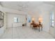Bright bedroom with tiled floors, desk, dresser, and ceiling fan at 3262 Steadman St, Punta Gorda, FL 33980