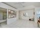 Bedroom with tiled floors, large art piece, and ensuite bathroom access at 3262 Steadman St, Punta Gorda, FL 33980