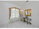 Bright dining room with a chandelier, large window, and elegant console table at 3262 Steadman St, Punta Gorda, FL 33980