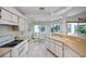 Efficient kitchen with white appliances, breakfast nook, and pool view at 3262 Steadman St, Punta Gorda, FL 33980