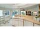 Bright kitchen features ample counter space, white cabinets, and a view of the pool at 3262 Steadman St, Punta Gorda, FL 33980