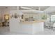 Bright kitchen with white cabinets, breakfast nook, and access to the pool area at 3262 Steadman St, Punta Gorda, FL 33980