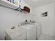 Convenient laundry room with washer, dryer, and utility sink at 3262 Steadman St, Punta Gorda, FL 33980