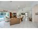 Spacious living room with pool view, comfortable seating, and large-screen TV at 3262 Steadman St, Punta Gorda, FL 33980