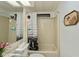 Clean bathroom with tub shower, toilet and sink at 368 Catamaran Ct, North Port, FL 34287