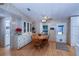 Bright dining area with wood table and chairs, and built-in hutch at 368 Catamaran Ct, North Port, FL 34287