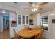 Dining area with wood table and chairs, and built-in hutch at 368 Catamaran Ct, North Port, FL 34287