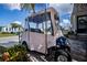Blue golf cart with tan top parked on driveway at 368 Catamaran Ct, North Port, FL 34287