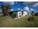 Single story home with white siding, landscaped yard at 368 Catamaran Ct, North Port, FL 34287