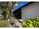White home exterior with lush landscaping and patio at 368 Catamaran Ct, North Port, FL 34287