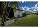White home with screen patio and small garden at 368 Catamaran Ct, North Port, FL 34287