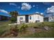 Single story home with white siding and landscaping at 368 Catamaran Ct, North Port, FL 34287