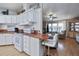 Efficient kitchen with white cabinets and breakfast bar at 368 Catamaran Ct, North Port, FL 34287