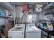 Laundry room with washer, dryer, and storage shelves at 368 Catamaran Ct, North Port, FL 34287