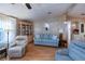 Relaxing living room with light blue sofa and comfy recliner at 368 Catamaran Ct, North Port, FL 34287