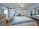 Bright main bedroom featuring a king bed and light blue decor at 368 Catamaran Ct, North Port, FL 34287