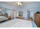 Main bedroom with a king-size bed and built-in mirrored closet at 368 Catamaran Ct, North Port, FL 34287