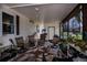 Relaxing screened porch with seating and plants at 368 Catamaran Ct, North Port, FL 34287