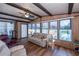 Sunroom features light beige sofas and a ceiling fan at 368 Catamaran Ct, North Port, FL 34287