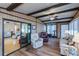Sunroom with multiple seating options and exercise equipment at 368 Catamaran Ct, North Port, FL 34287
