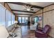 Relaxing sunroom with seating, a workspace, and large windows at 368 Catamaran Ct, North Port, FL 34287