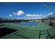 Well lit tennis court with green surface at 368 Catamaran Ct, North Port, FL 34287