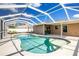 Inviting pool area with screened enclosure, providing shade and relaxation at 3863 S Chamberlain Blvd, North Port, FL 34286