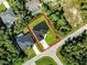 An aerial view of a modern single-Gathering home with surrounding lots and neighboring houses at 4301 Marcella Ter, North Port, FL 34286