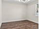 Unfurnished bedroom with wood-like floors and a large window at 4301 Marcella Ter, North Port, FL 34286