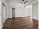 Spacious living room with wood-look flooring, ceiling fan, and recessed lighting at 4301 Marcella Ter, North Port, FL 34286